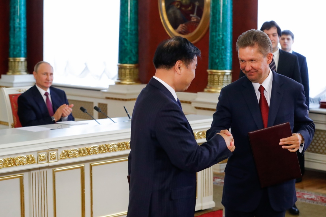 Vladimir Putin, Wang Yilin, and Alexey Miller. Photo by TASS